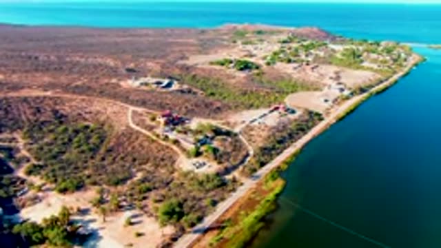 MULEGE BCS MEXICO-2022: Vehicle Traveling Along Coastal Road