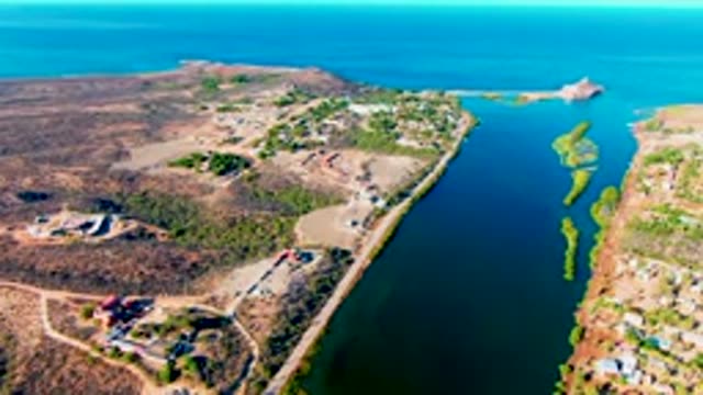 MULEGE BCS MEXICO-2022: Boat Moving Through Narrow Coastal Canal