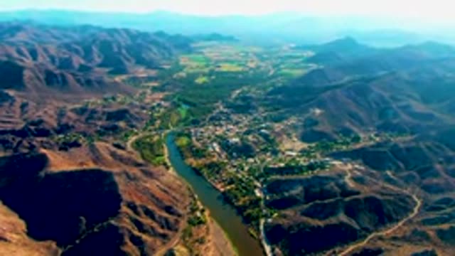 MULEGE BCS MEXICO-2022: River Winding Through Mountain Valley with Shifting Shadows