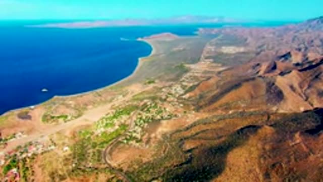 MULEGE BCS MEXICO-2022: Coastal Mountain Landscape with Moving Boat