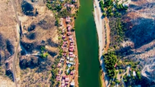 MULEGE BCS MEXICO-2022: Car Moving Along Canal and Road
