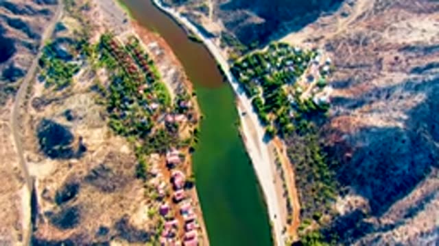 MULEGE BCS MEXICO-2022: Receding River Through Mountainous Residential Landscape