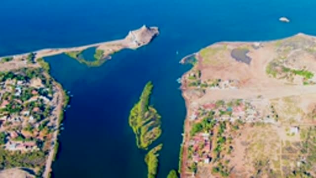 MULEGE BCS MEXICO-2022: Sailboat Moving Through Water Channel Between Shores