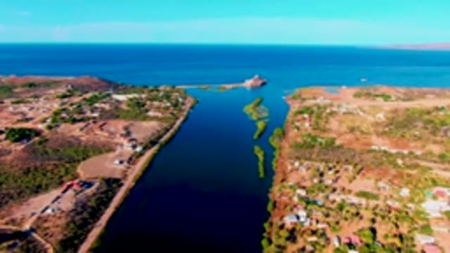MULEGE BCS MEXICO-2022: Narrow Waterway Between Two Coastal Landmasses with Moving Vehicle