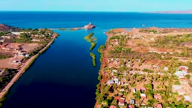 MULEGE BCS MEXICO-2022: Narrow Coastal Waterway with Distant Island Structure and Buildings