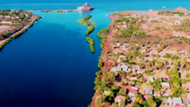 MULEGE BCS MEXICO-2022: Aerial Flight Along Coastal Inlet with Buildings and Greenery