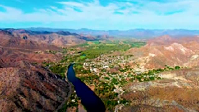 MULEGE BCS MEXICO-2022: Vehicle Moving Along River Valley Road