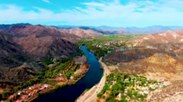 MULEGE BCS MEXICO-2022: Winding River and Highway in Mountain Valley