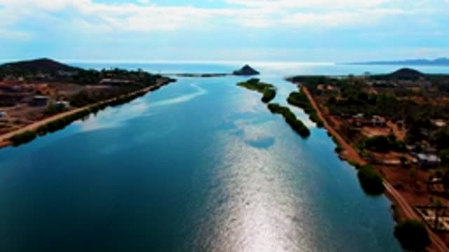 MULEGE BCS MEXICO-2022: Calm Waterway with Tree-Lined Roads