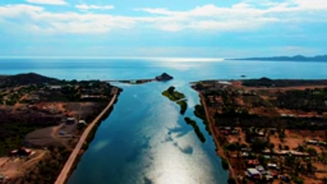 MULEGE BCS MEXICO-2022: Waterway with Moving Clouds and Road Traffic