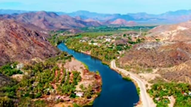 MULEGE BCS MEXICO-2022: Winding River Through Mountain Valley with Moving Car