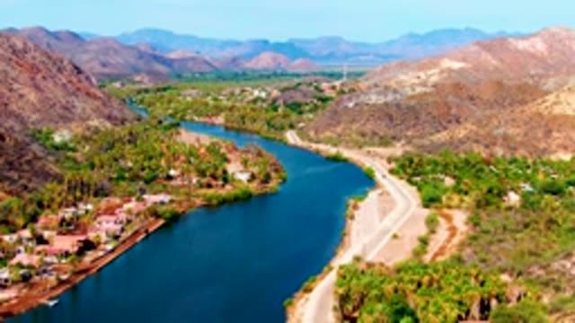 MULEGE BCS MEXICO-2022: Boat Traveling on River in Mountain Valley