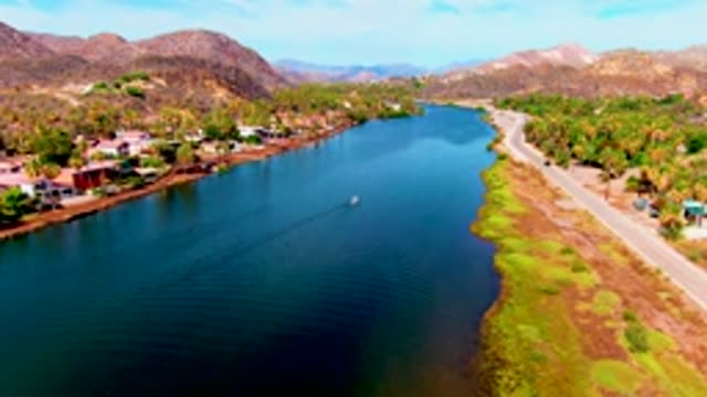 MULEGE BCS MEXICO-2022: Overhead View of Lake and Road with Passing Vehicles