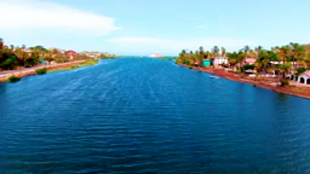 MULEGE BCS MEXICO-2022: Boat Gliding Along Canal Shoreline