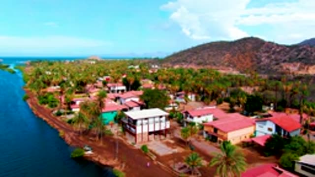 MULEGE BCS MEXICO-2022: Coastal Village with Person Walking on Road