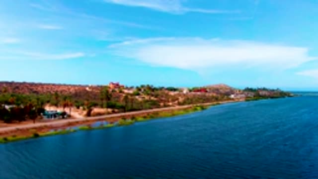 MULEGE BCS MEXICO-2022: Vehicle Moving on Road Next to Water
