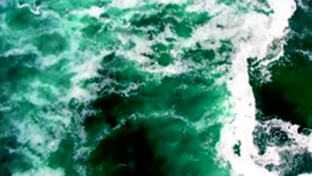 Overhead View of Ocean Waves and White Foam