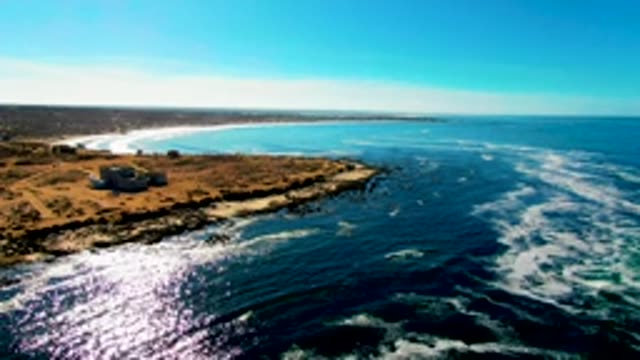 Coastal Building and Ocean Waves Aerial