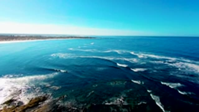 Ocean Waves Breaking on Rocky Shore
