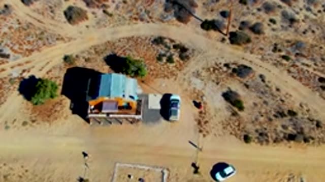 Desert Shack with Moving Vehicles and People