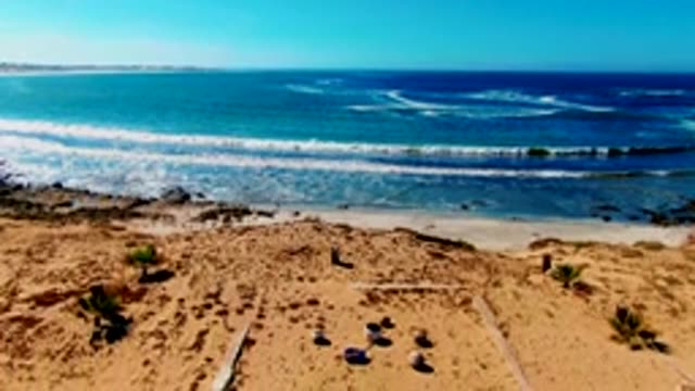 Beach Scene with Gradual Camera Pan and Sand Tracks