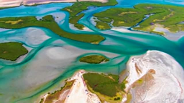 Flowing Coastal Water Around Green Islands