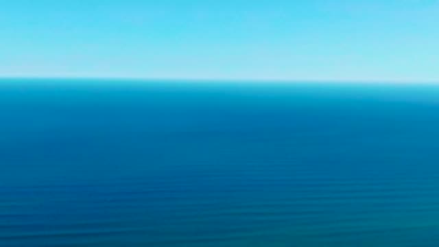 Calm Ocean Surface with Gentle Waves and Clear Sky