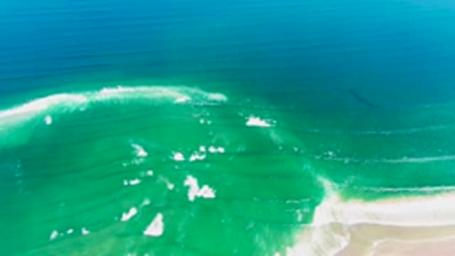 Ocean Waves with White Foam Moving Toward Shore