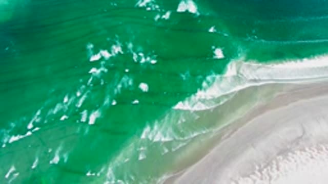 Waves Breaking on Sandy Ocean Shore