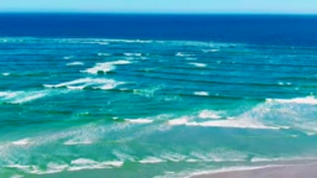 LA BOCANA BCS MEXICO-2022: Ocean Waves Rolling Toward Sandy Shore