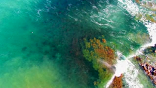 LA BOCANA BCS MEXICO-2022: Waves Crashing Against Rocky Ocean Shore