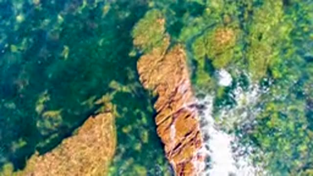 LA BOCANA BCS MEXICO-2022: Shallow Ocean Water Flowing Over Rocky Seabed