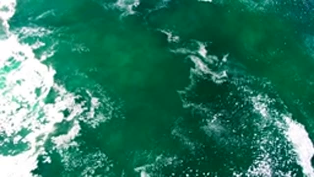 LA BOCANA BCS MEXICO-2022: Surfers Navigating Ocean Waves From Above