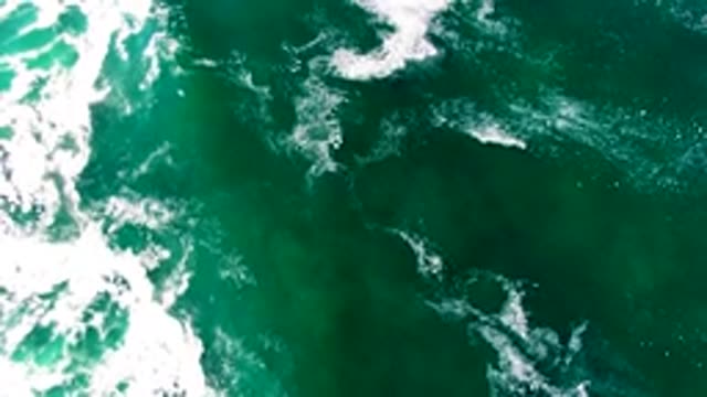 LA BOCANA BCS MEXICO-2022: Ocean Waves with a Passing Surfboard