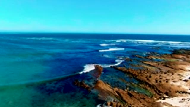 LA BOCANA BCS MEXICO-2022: Waves Breaking on Rocky Ocean Shore