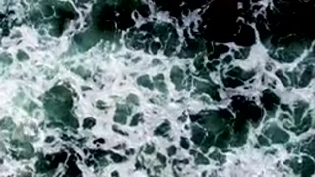 LA BOCANA BCS MEXICO-2022: Waves Crashing Over Dark Ocean Rocks