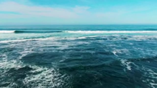 LA BOCANA BCS MEXICO-2022: Ocean Waves Rolling Toward Rocky Shore