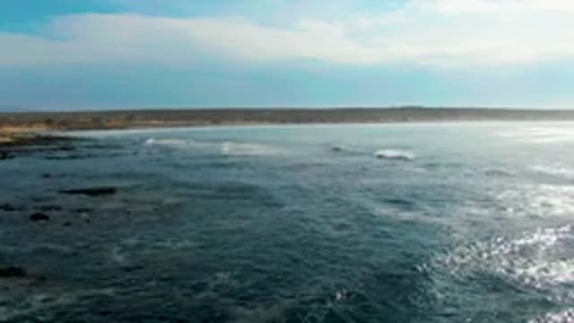 LA BOCANA BCS MEXICO-2022: Ocean Waves Rolling Toward Rocky Coast
