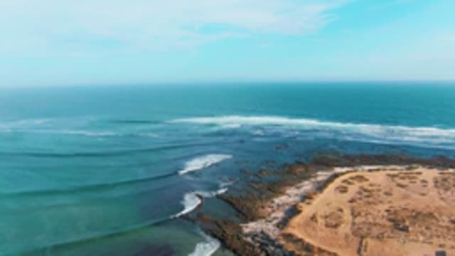 LA BOCANA BCS MEXICO-2022: Waves Crashing on Rocky Shoreline with Sandy Beach
