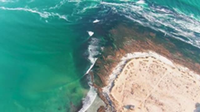 LA BOCANA BCS MEXICO-2022: Ocean Waves Rolling Onto Sandy Beach Coastline