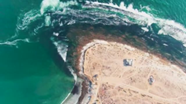 LA BOCANA BCS MEXICO-2022: Waves Crashing on Sandy Shore with Small Huts