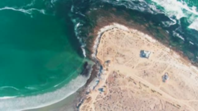 LA BOCANA BCS MEXICO-2022: Waves Moving Along Rocky Coastal Shore