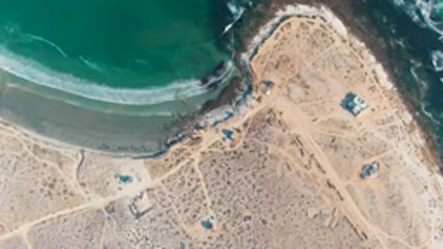 LA BOCANA BCS MEXICO-2022: Ocean Waves Moving Along Sandy Coastal Shore