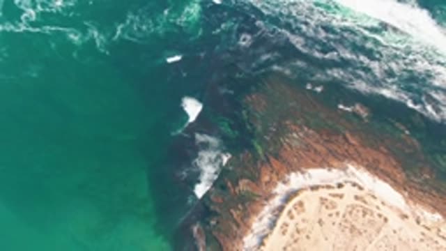 LA BOCANA BCS MEXICO-2022: Waves Crashing Against Rocky Shore and Sandy Beach