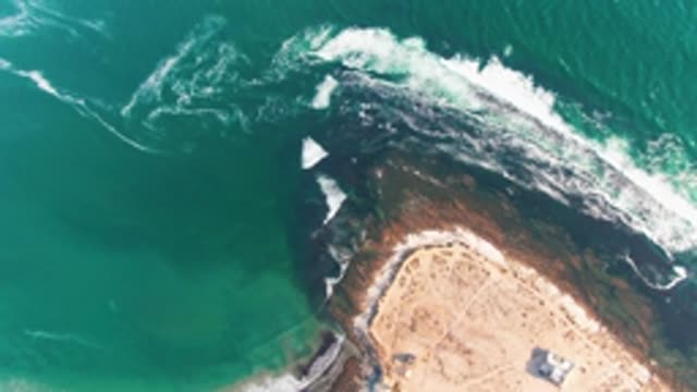 LA BOCANA BCS MEXICO-2022: Waves Crashing on Rocky Shore by Sandy Beach