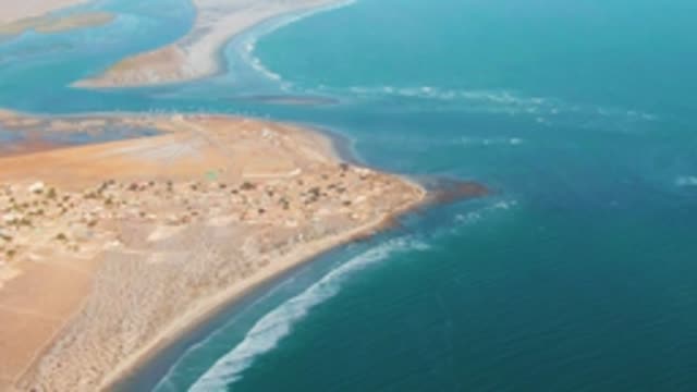 LA BOCANA BCS MEXICO-2022: Coastal Settlement on Sandy Shore by Turquoise Ocean