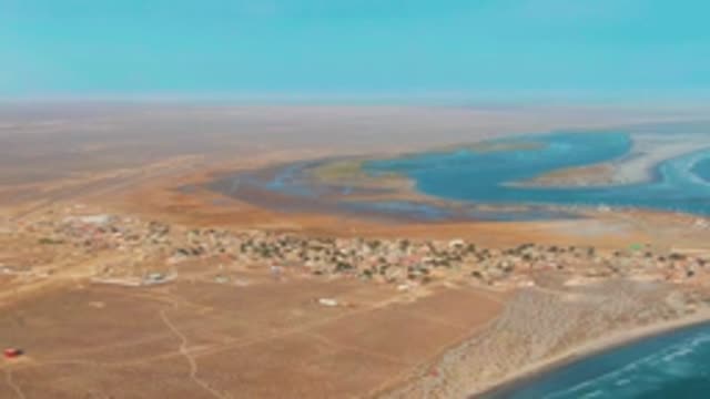 LA BOCANA BCS MEXICO-2022: Coastal Desert Settlement with Moving Vehicle