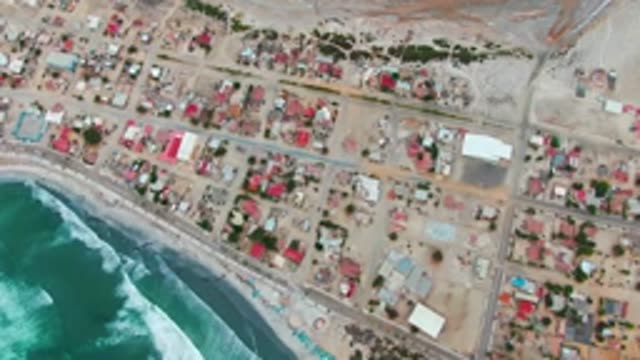 PUENTA ABREOJOS BCS MEXICO-2022: Coastal Settlement with Ocean Waves Crashing on Shore