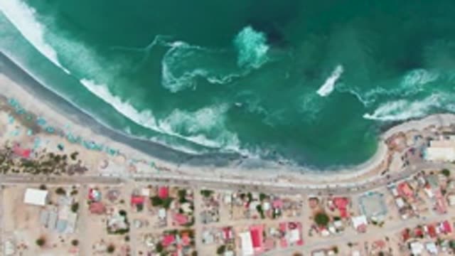 PUENTA ABREOJOS BCS MEXICO-2022: Ocean Waves Approaching Coastal Town Beach