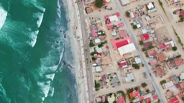 PUENTA ABREOJOS BCS MEXICO-2022: Ocean Waves Crashing Along Coastal Road and Town